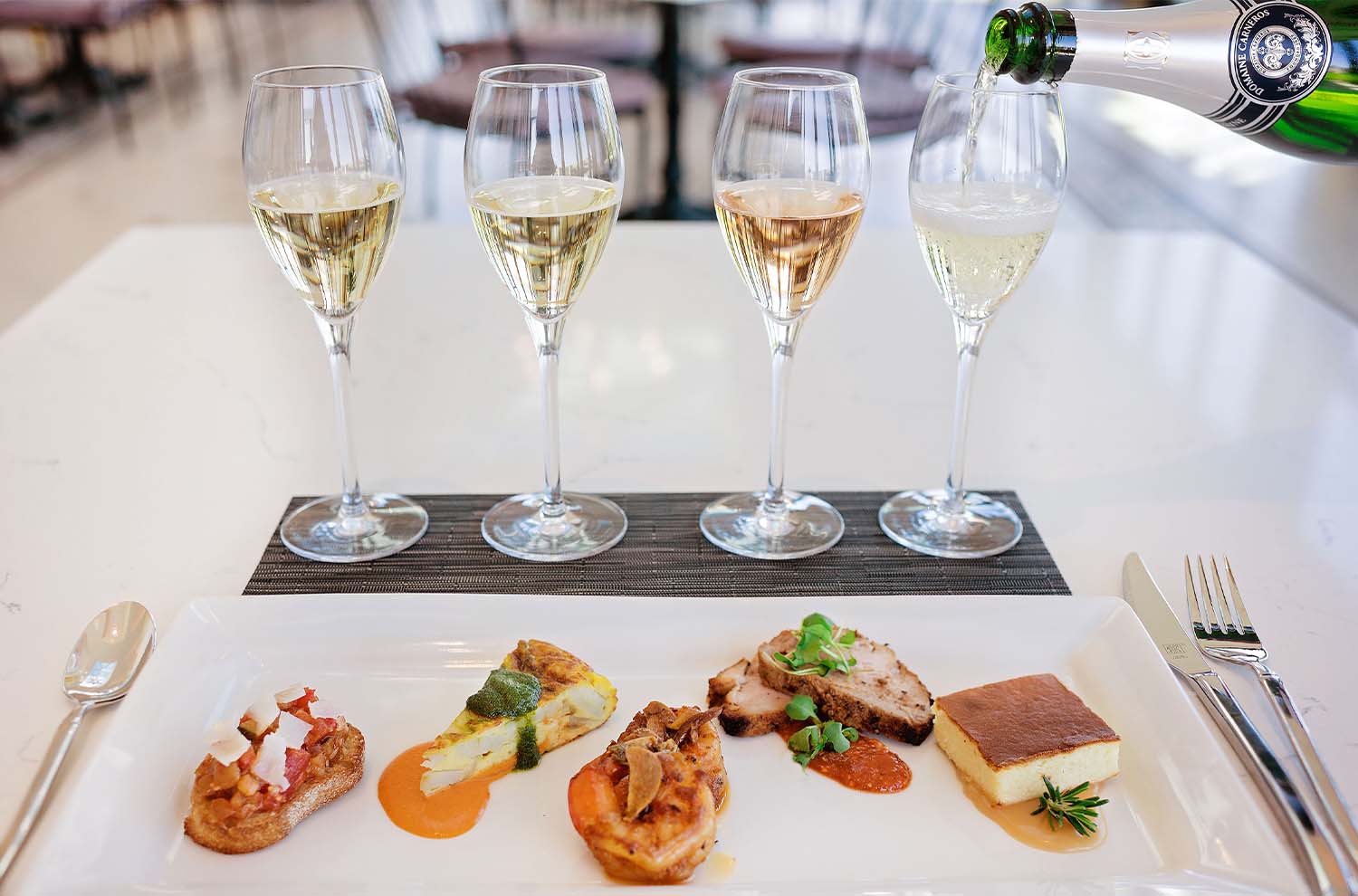 4 wine glasses with 5 food bites on plate