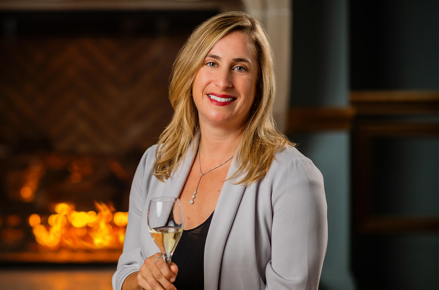 portrait of Remi Cohen infront of fireplace