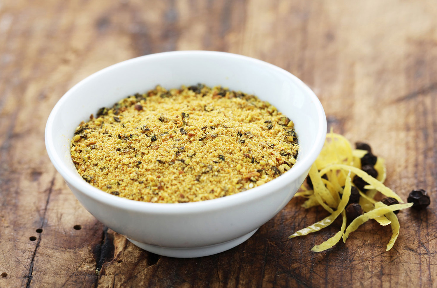 bowl of dry rub ingredients on wooden cutting board