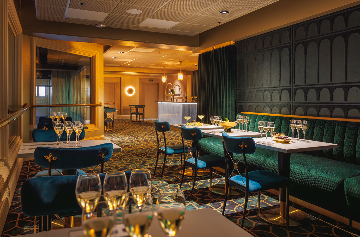 View of the Salon des Reves room with tables of sparkling wine flights and food offerings
