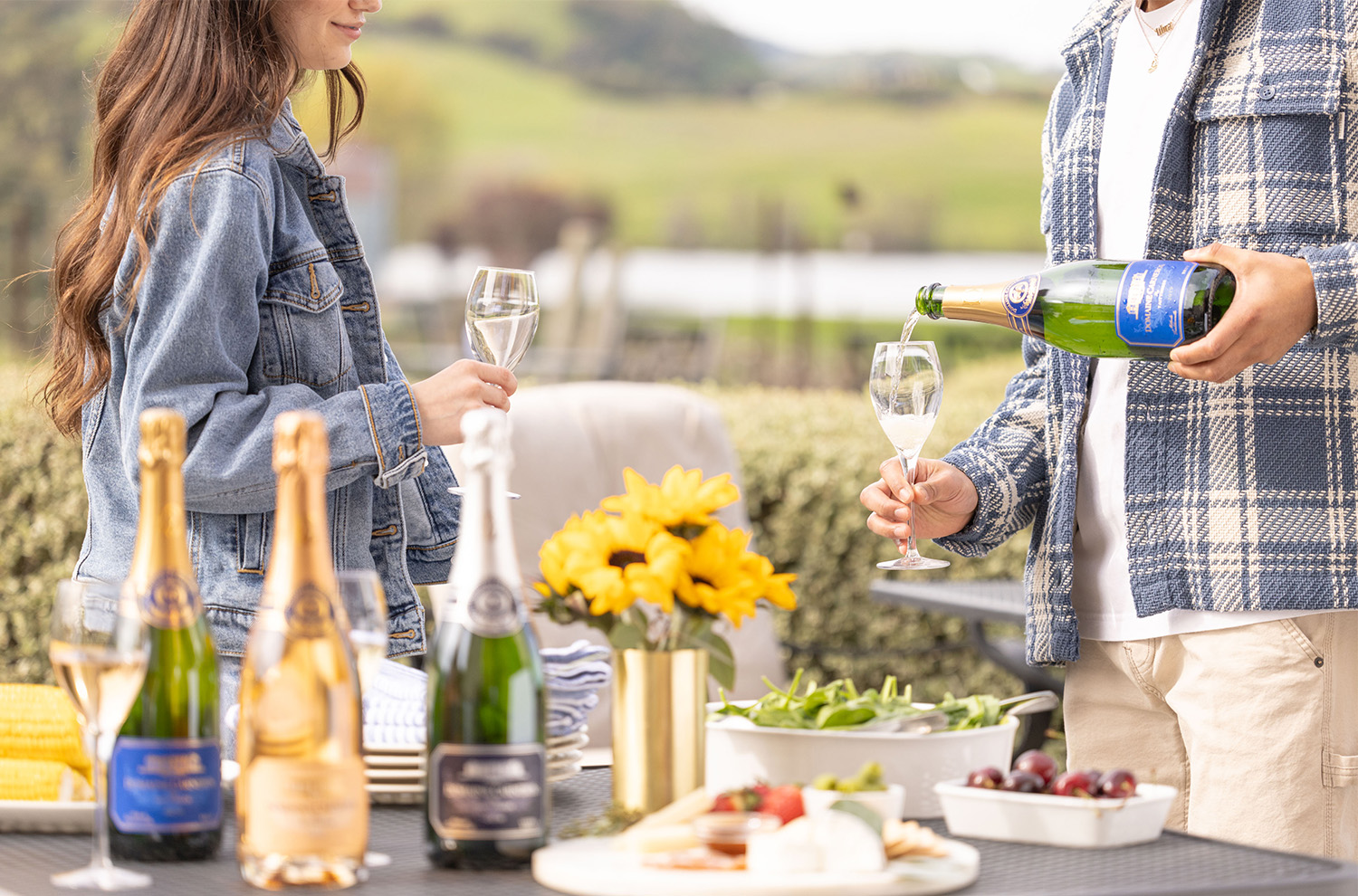 Summer BBQ table with Estate Brut being poured into someones glass