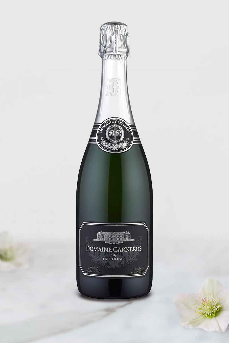 Bottle of Blanc de Noir on marble background
