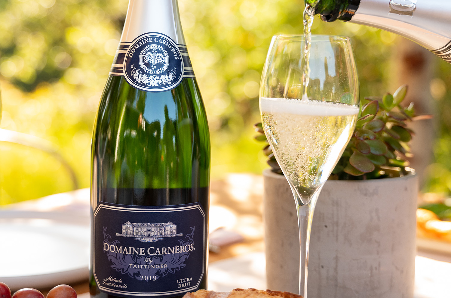 bottle of Ultra Brut and glass being poured