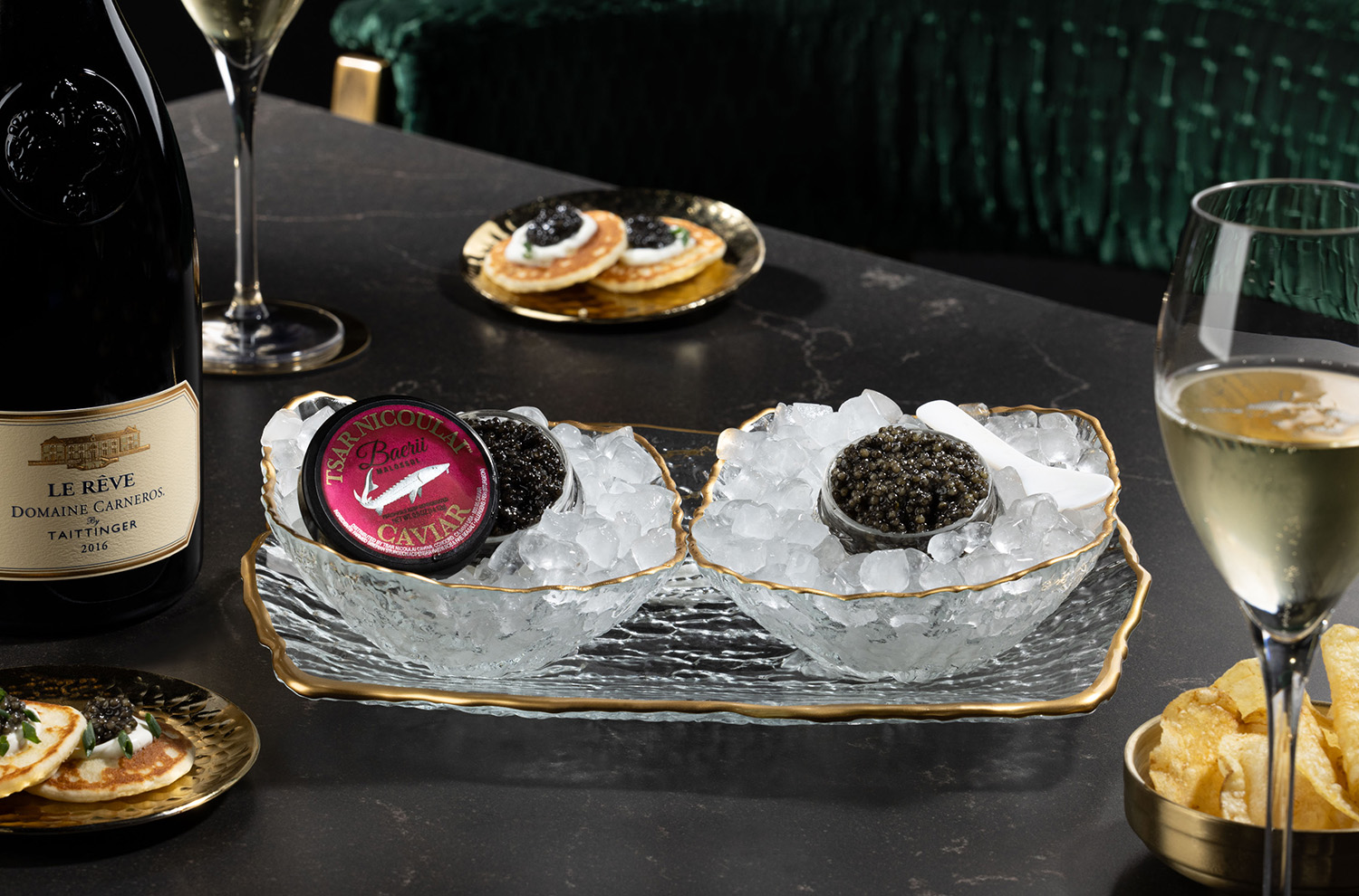 Imported caviar on ice with bottle of Le Reve