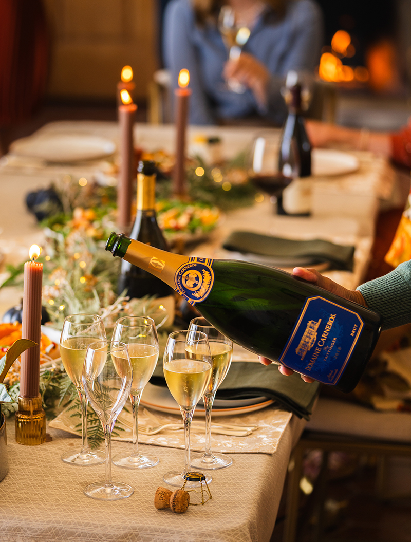 Magnum being poured of Domaine Carneros on holiday table