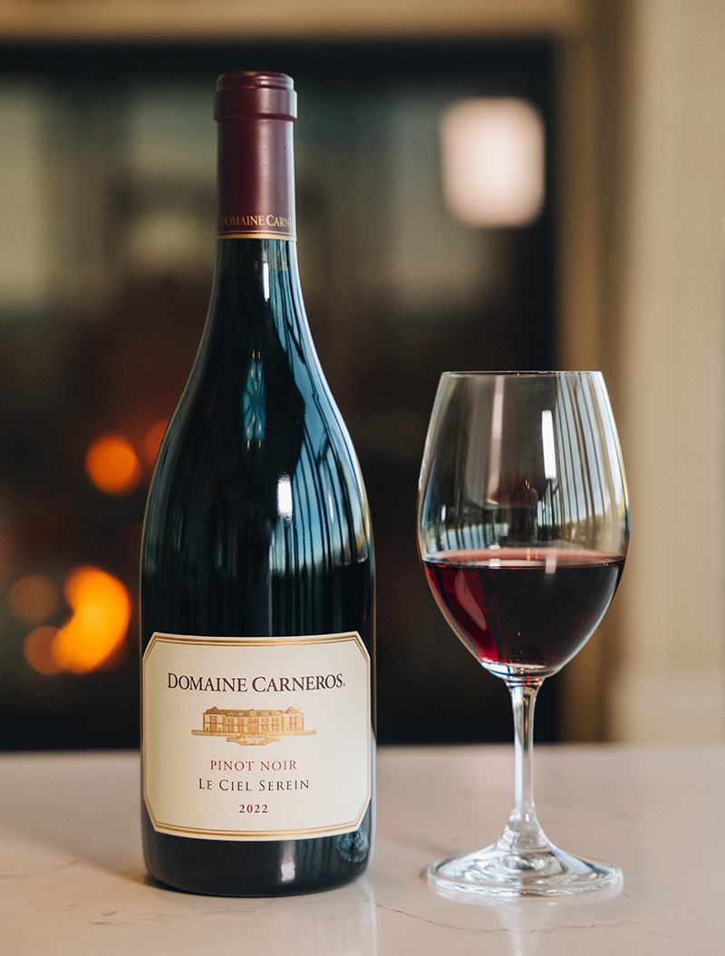 Le Ciel Serein Pinot Noir with fireplace background
