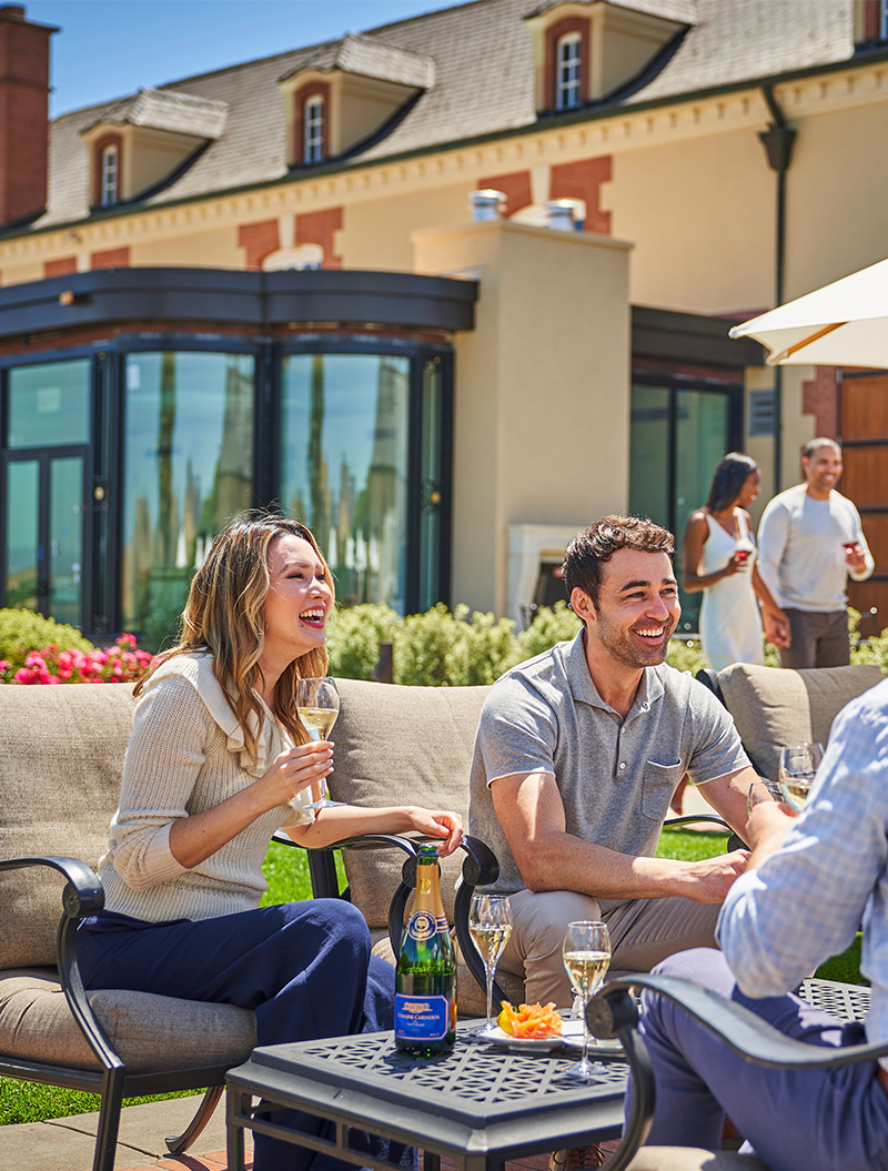 People enjoying wines on the club patio