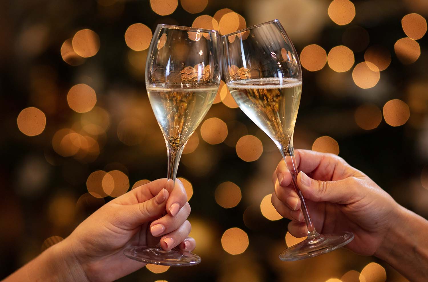 Two glasses clinking