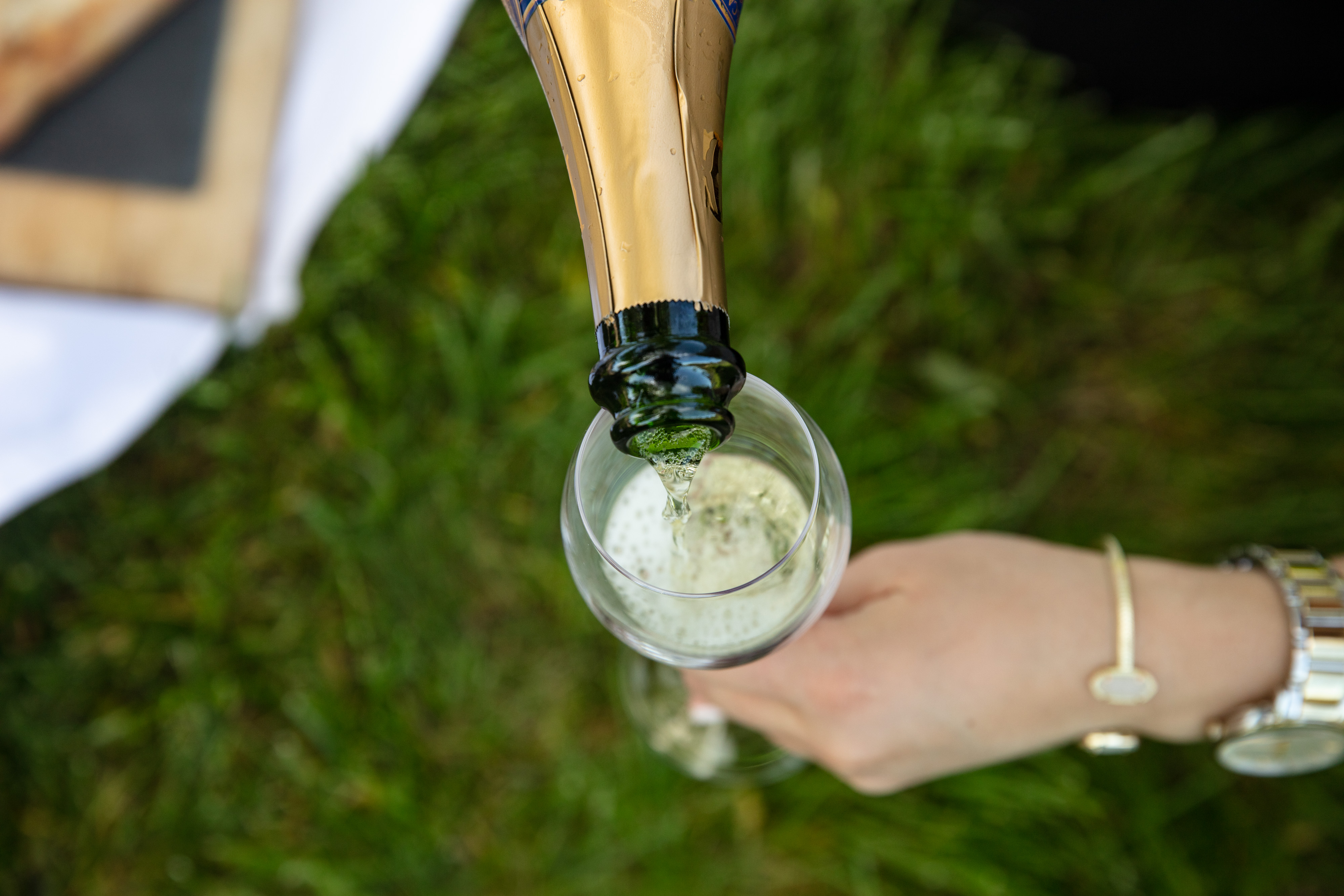 Pouring sparkling wine into glass